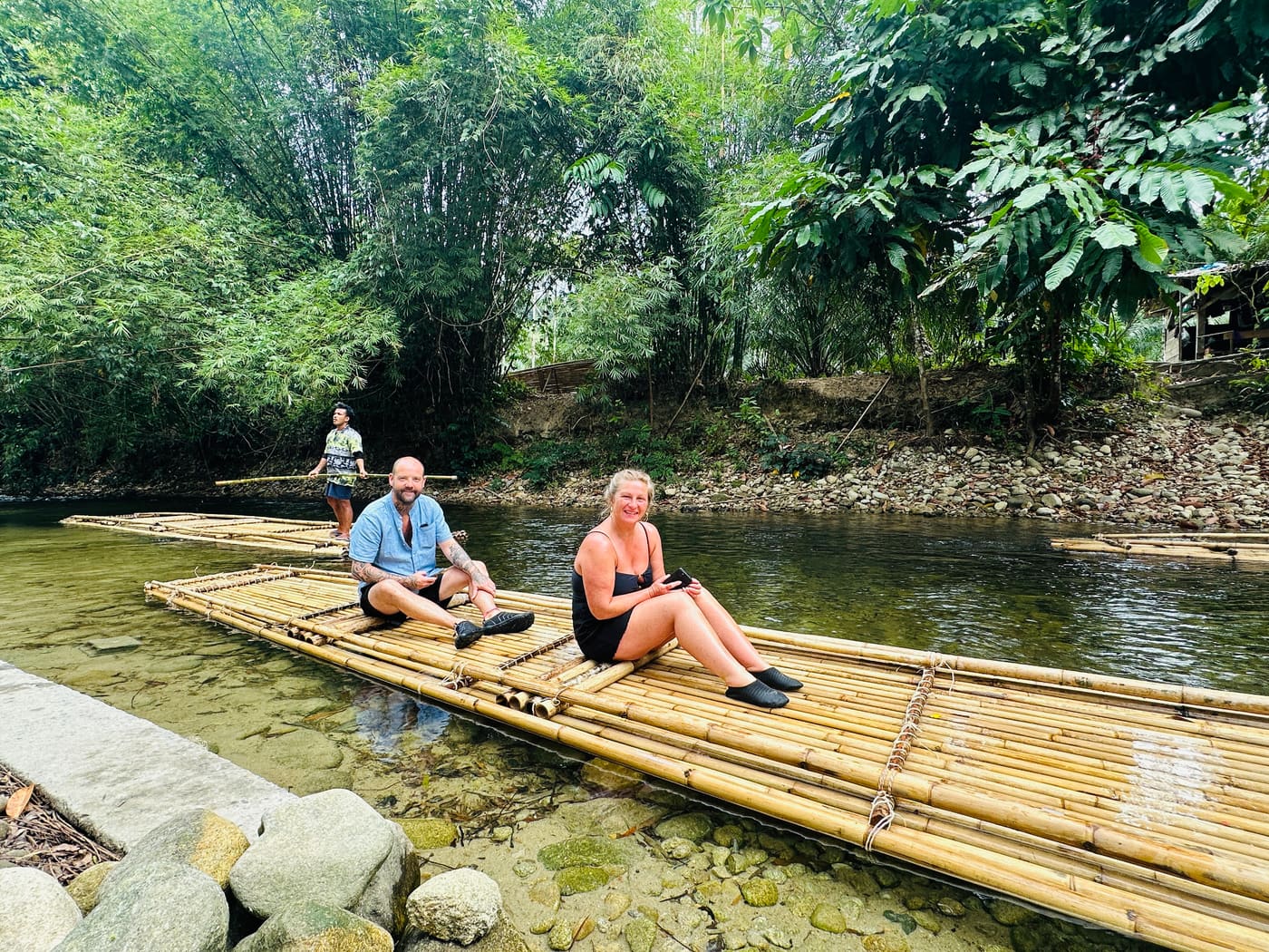 Couple enjoying a bamboo rafting trip