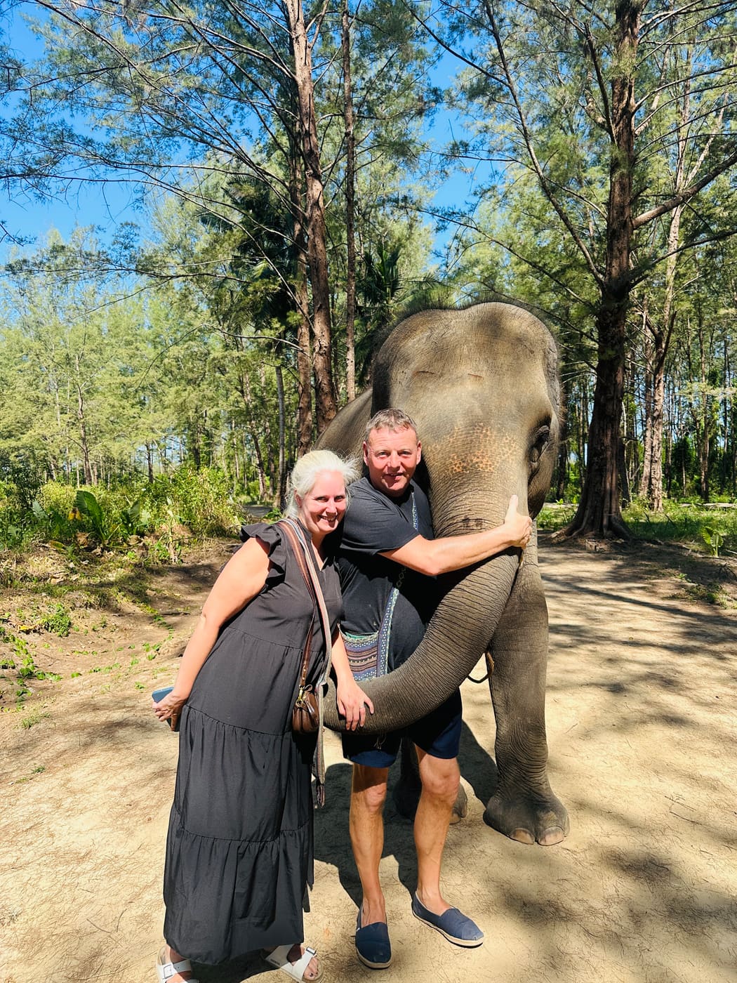 Guests with an elephant during a nature tour